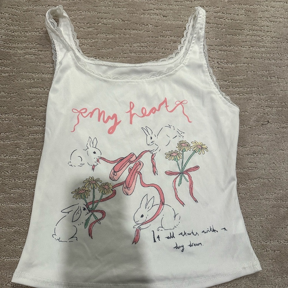 a white cute tank top no tags but rarely worn